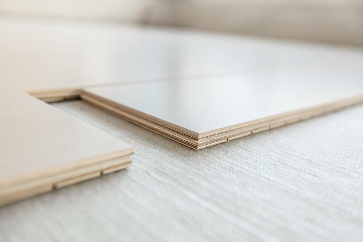 Panels of engineered wood flooring being installed